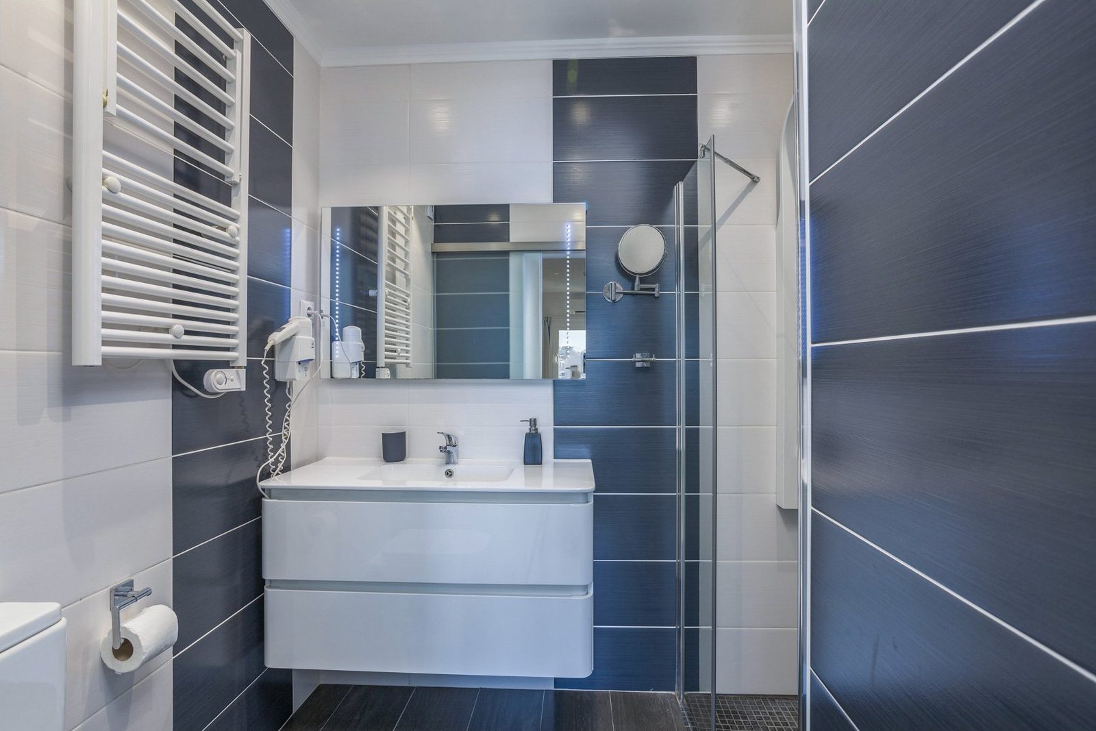 Bathroom with walk-in shower and heated towel rail