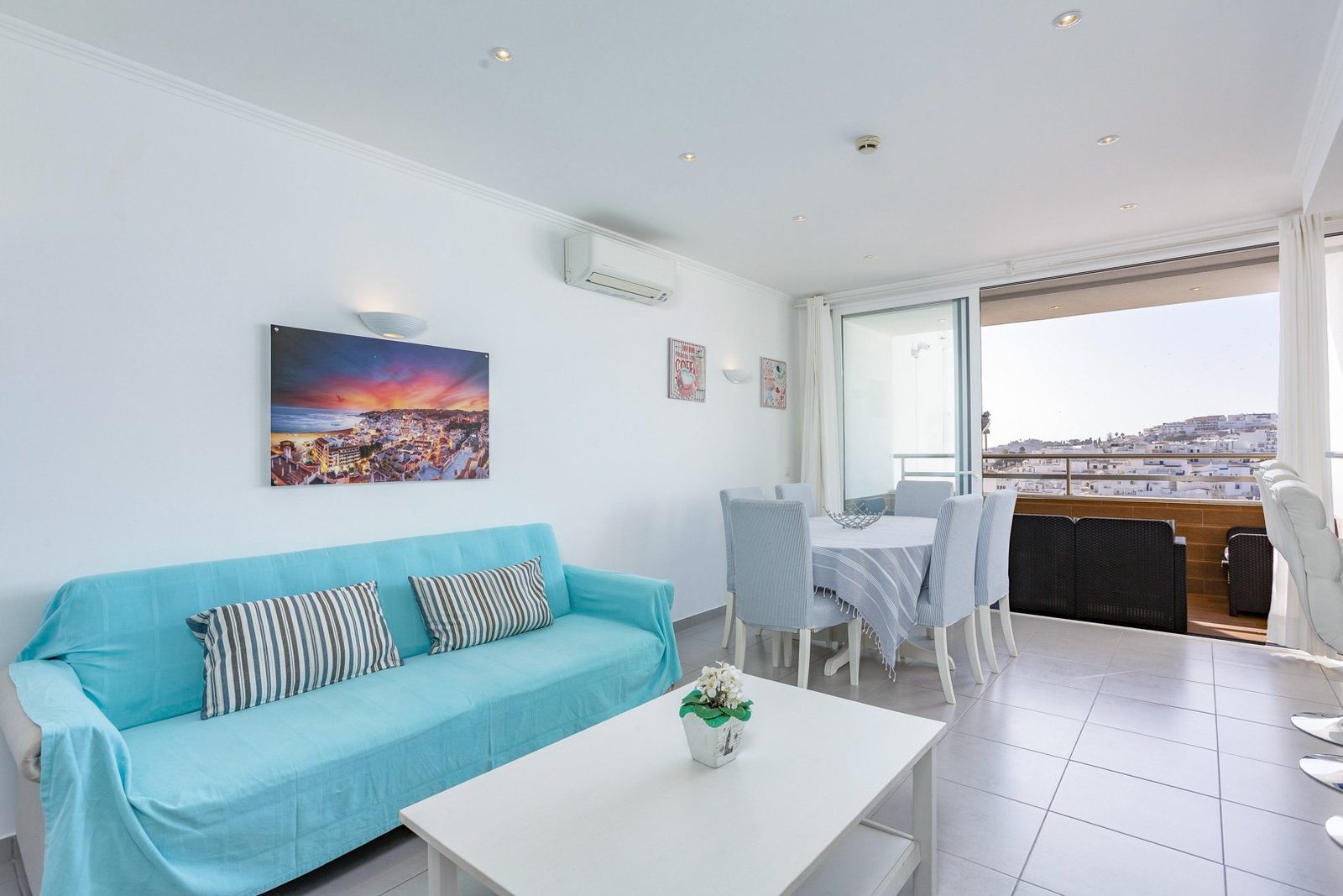 Living room with sofa and balcony access