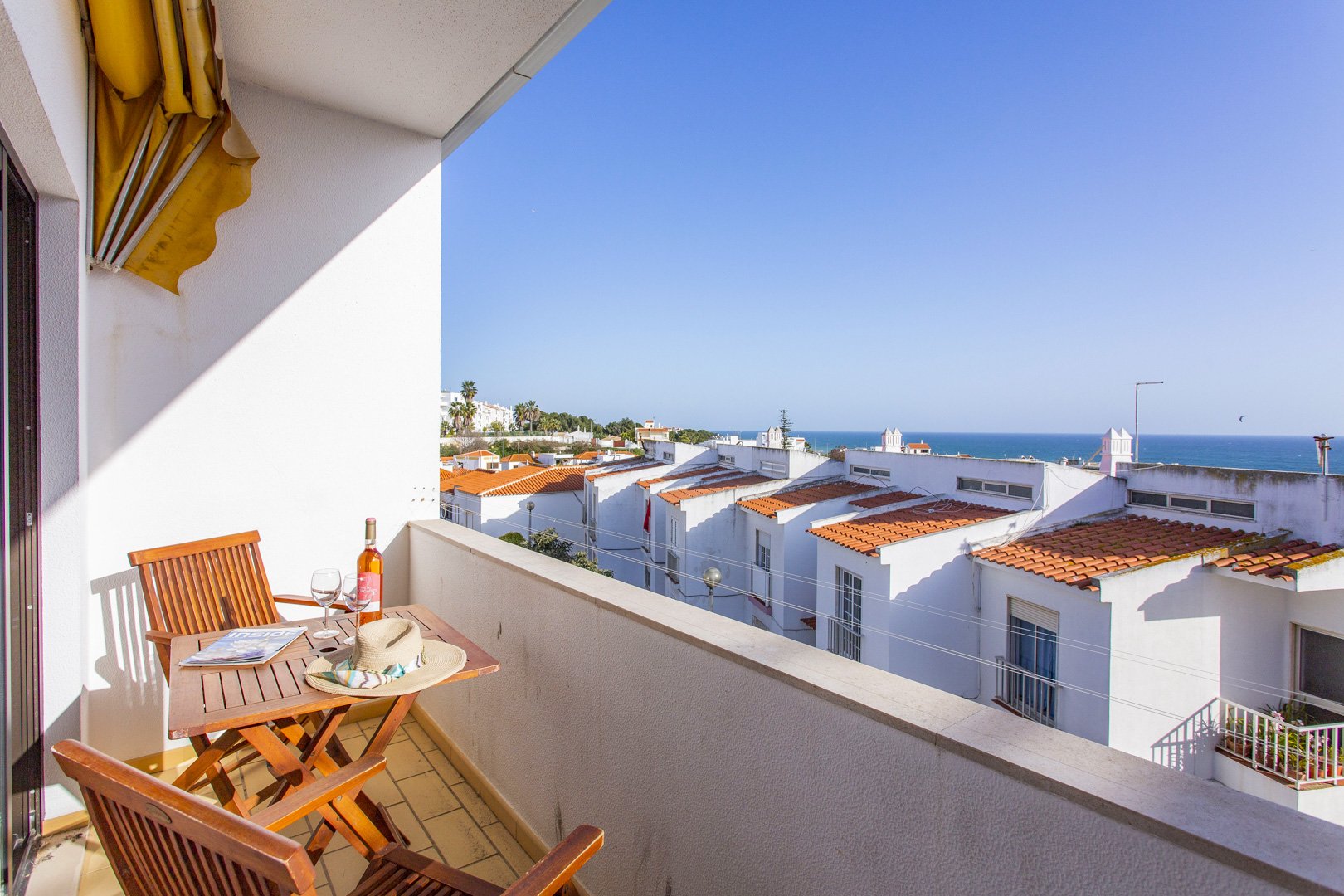 Balcony with bistro table and sea view, alternate view