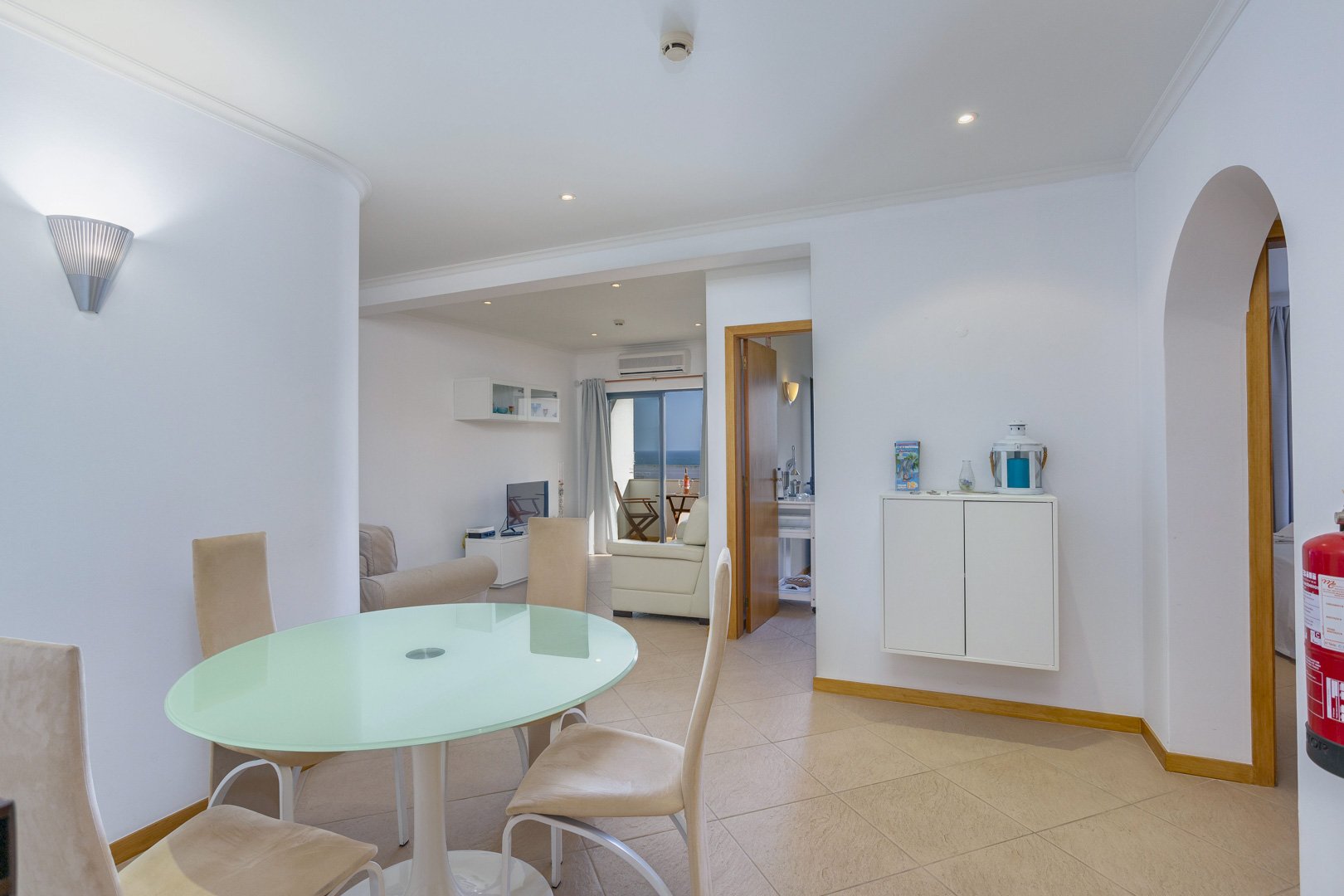 Dining area near the entrance with glass table