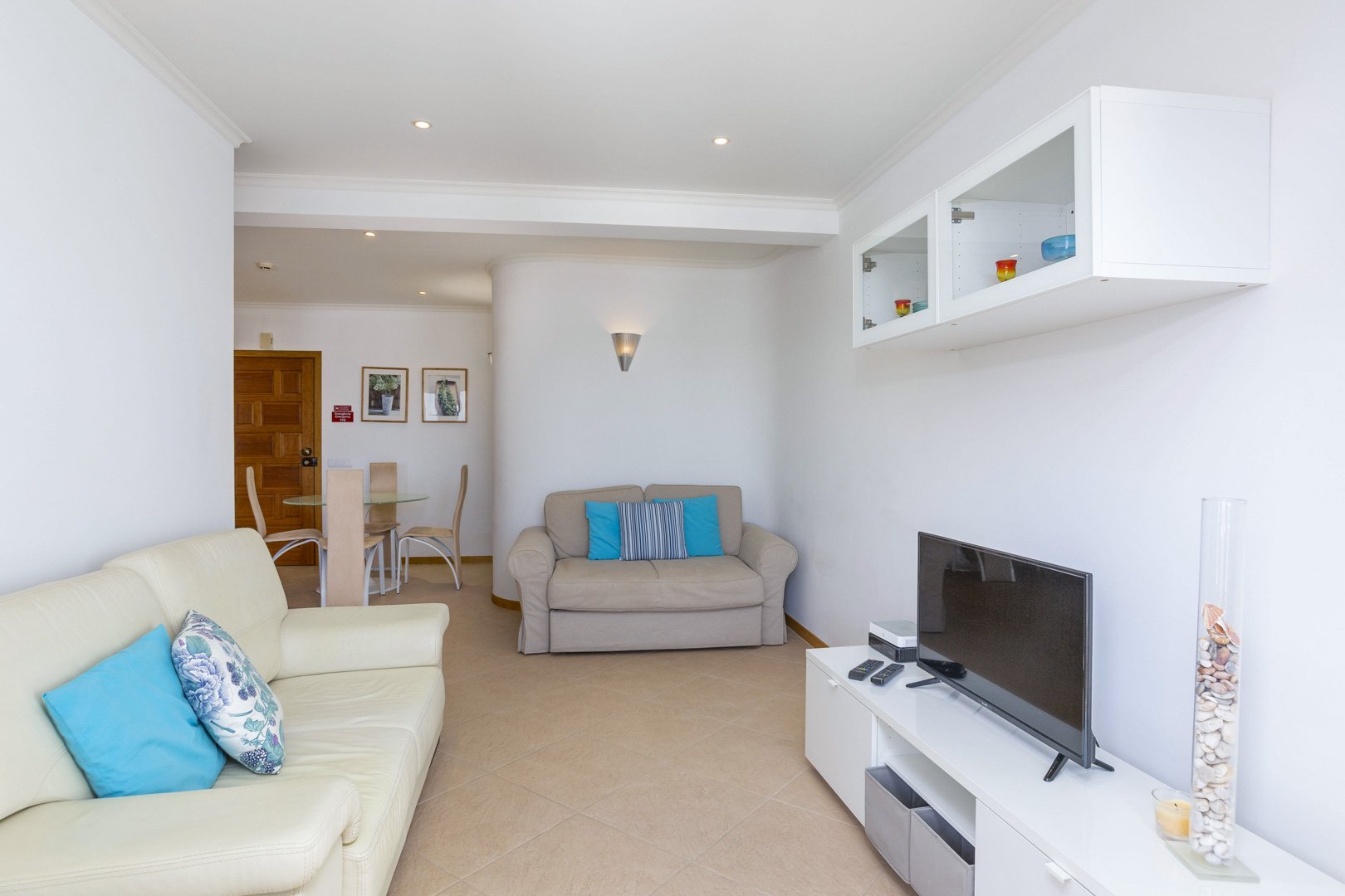 Living room with two sofas and TV unit