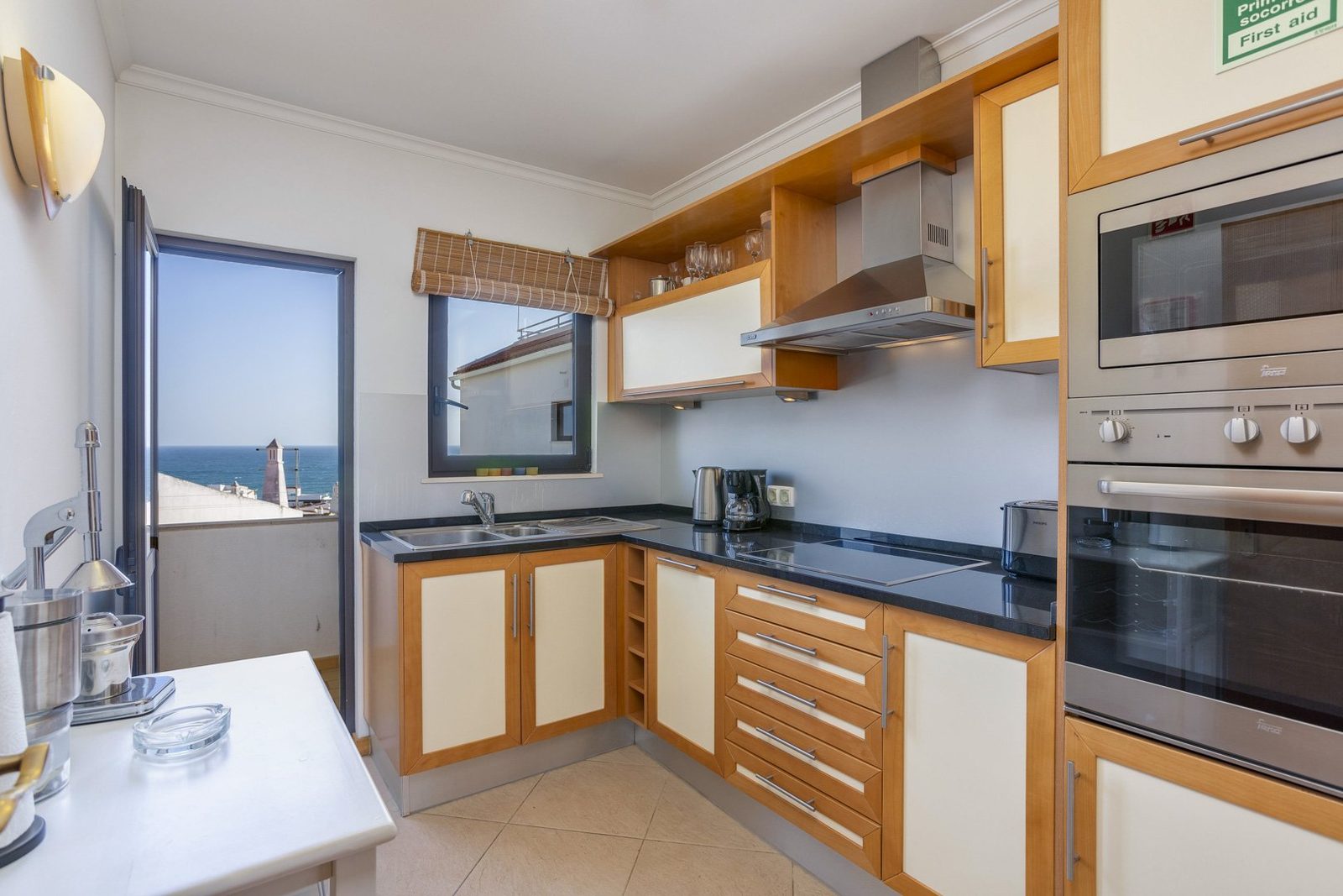 Kitchen with sea view and balcony access