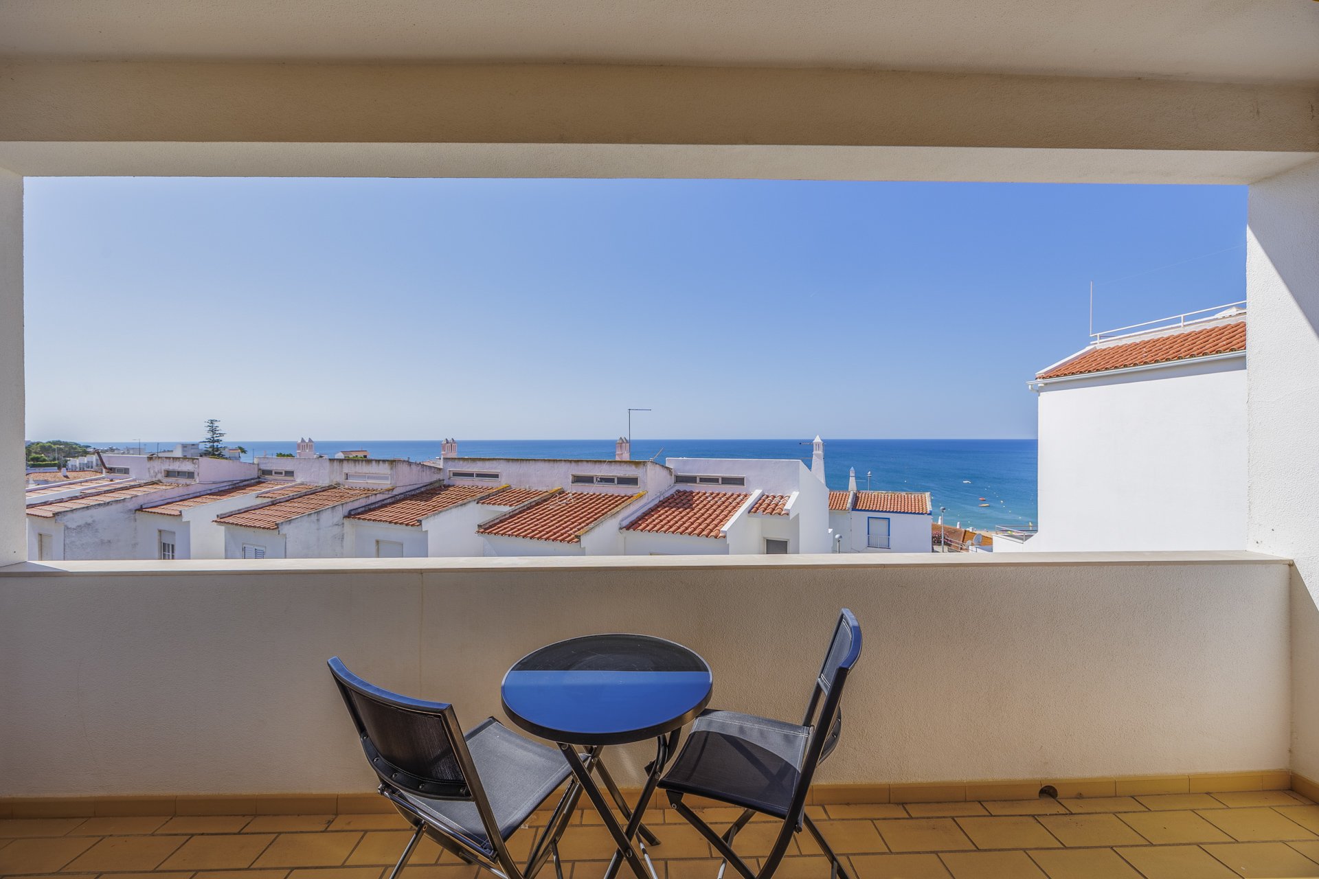 Balcony with bistro table and sea view