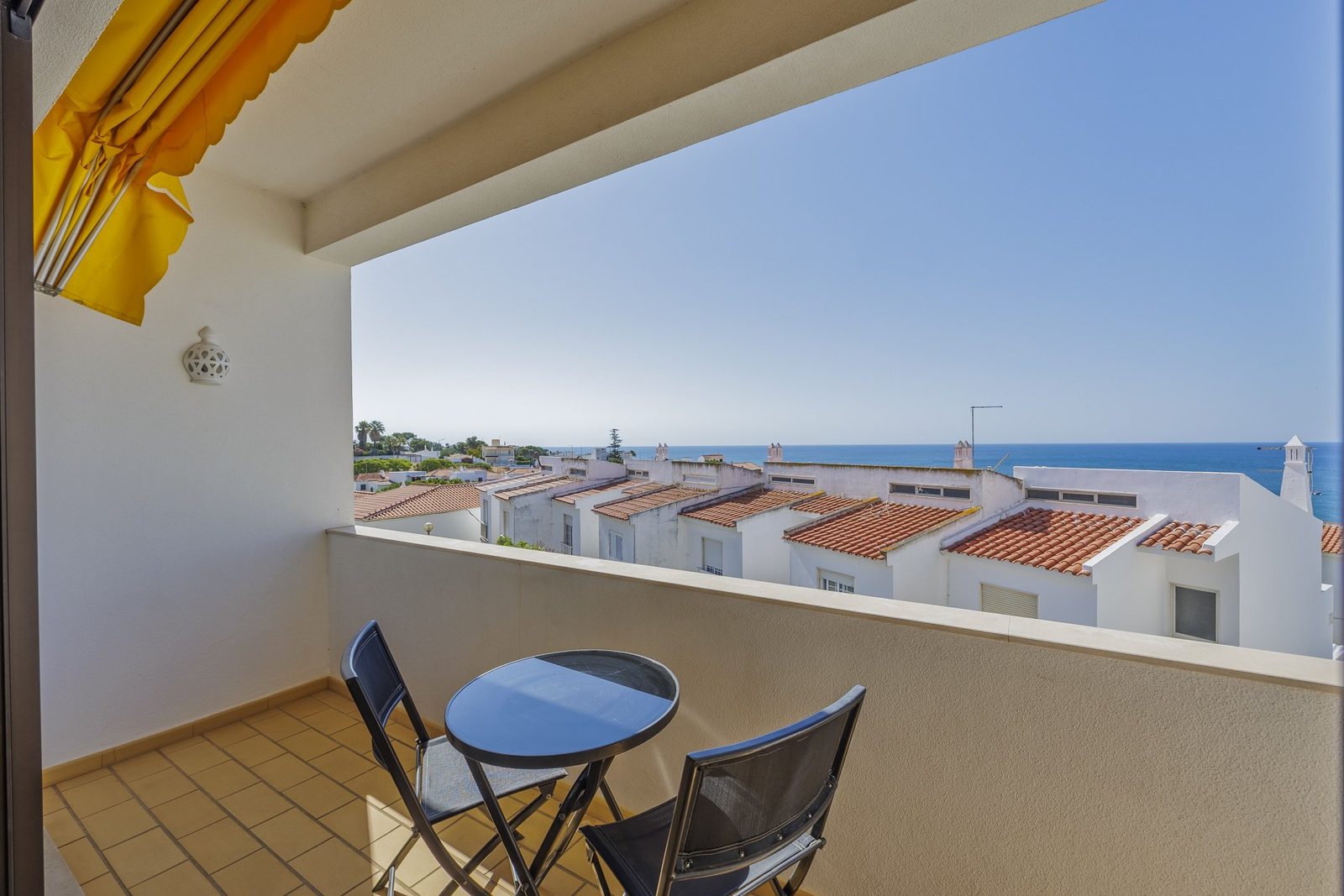 Balcony with round table and panoramic sea view