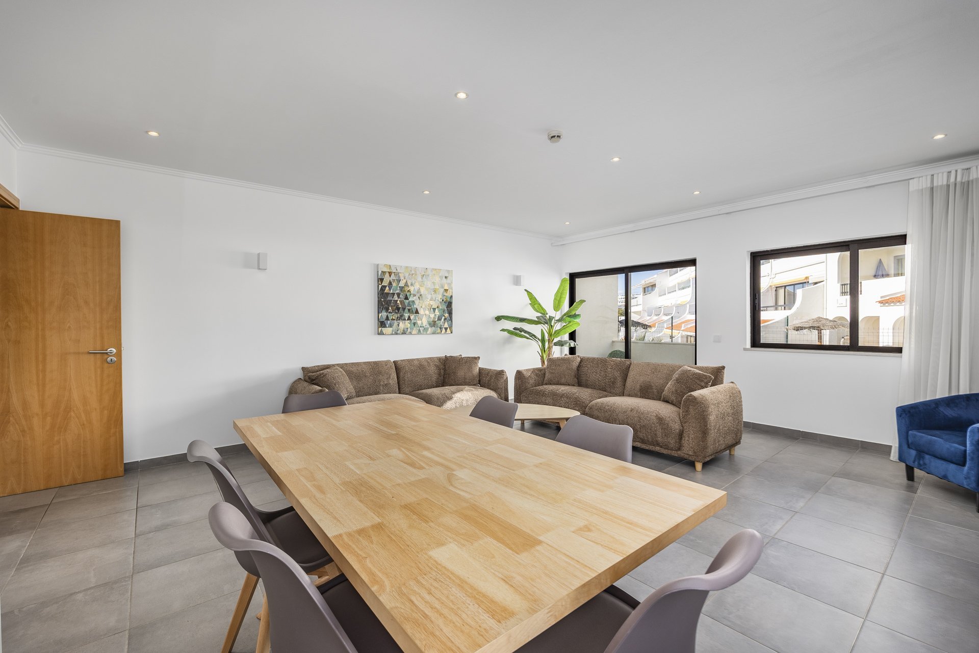 Dining table with living room seating in the background