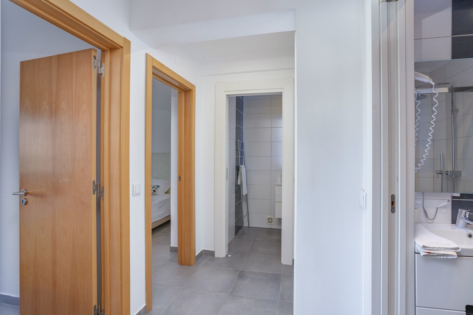 Hallway leading to bedroom and bathroom