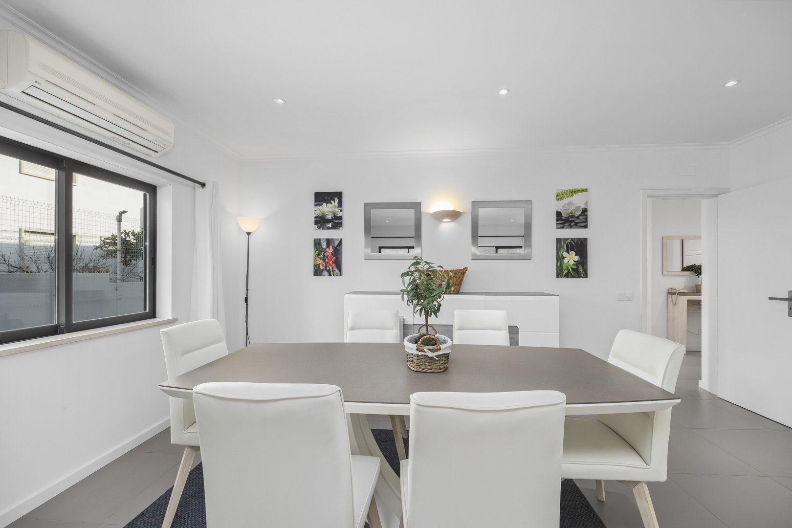 Dining area with window and hallway view