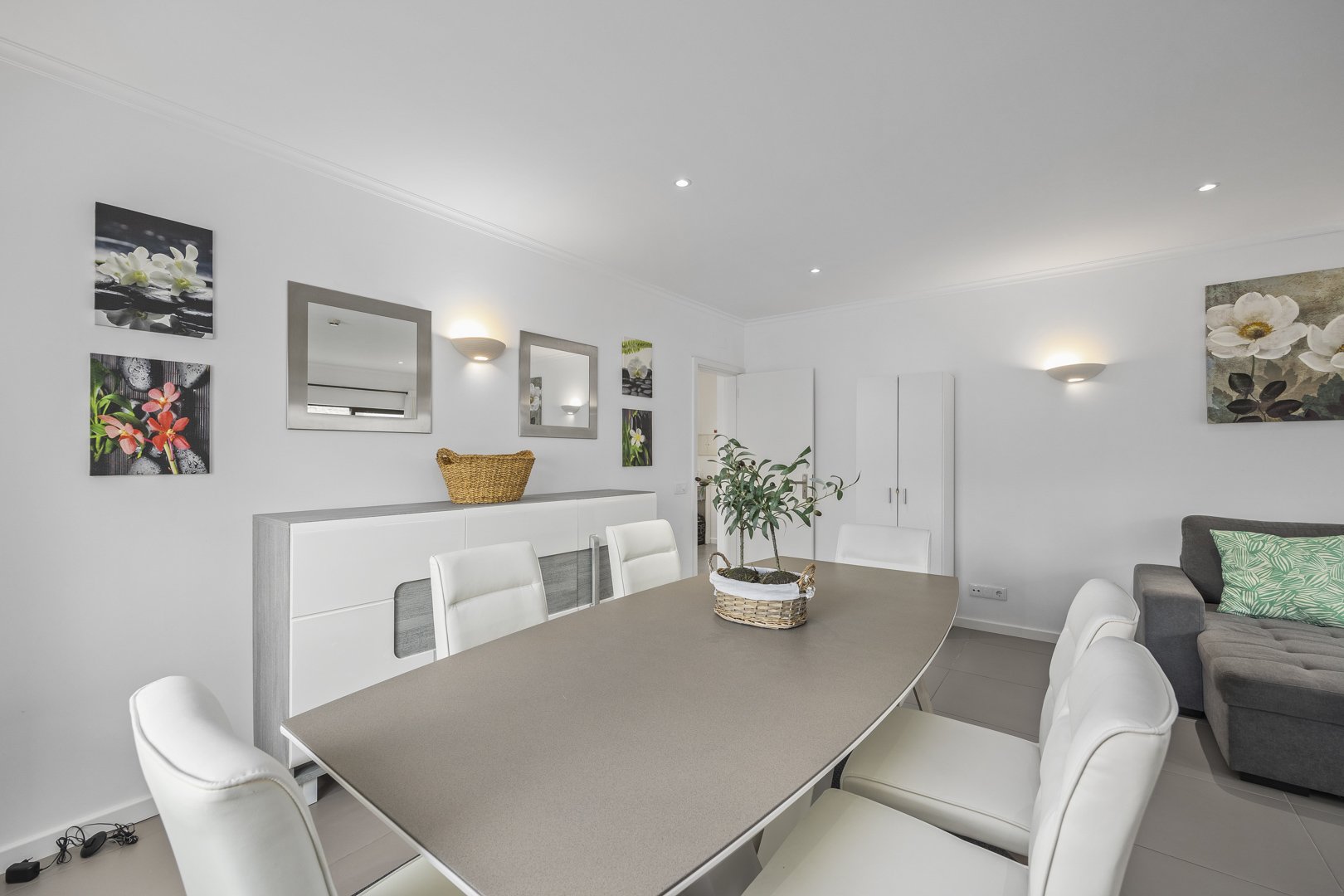 Dining table for six with sideboard and wall art