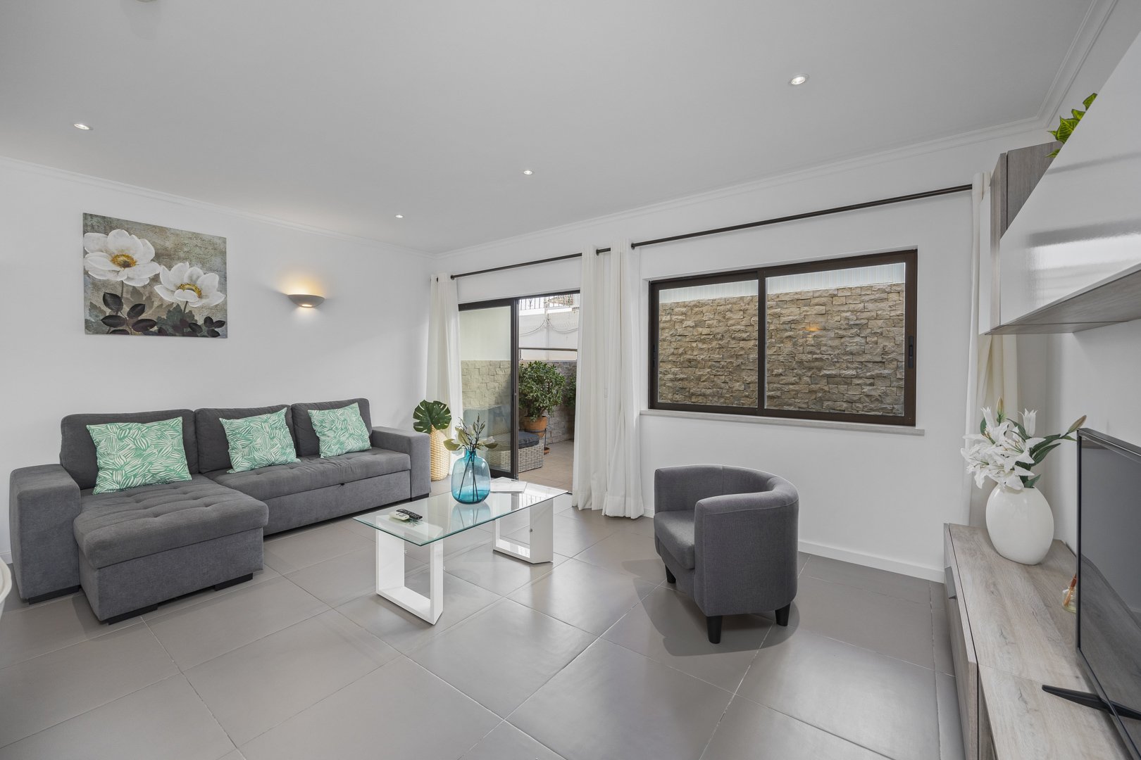 Living room seating area with terrace access