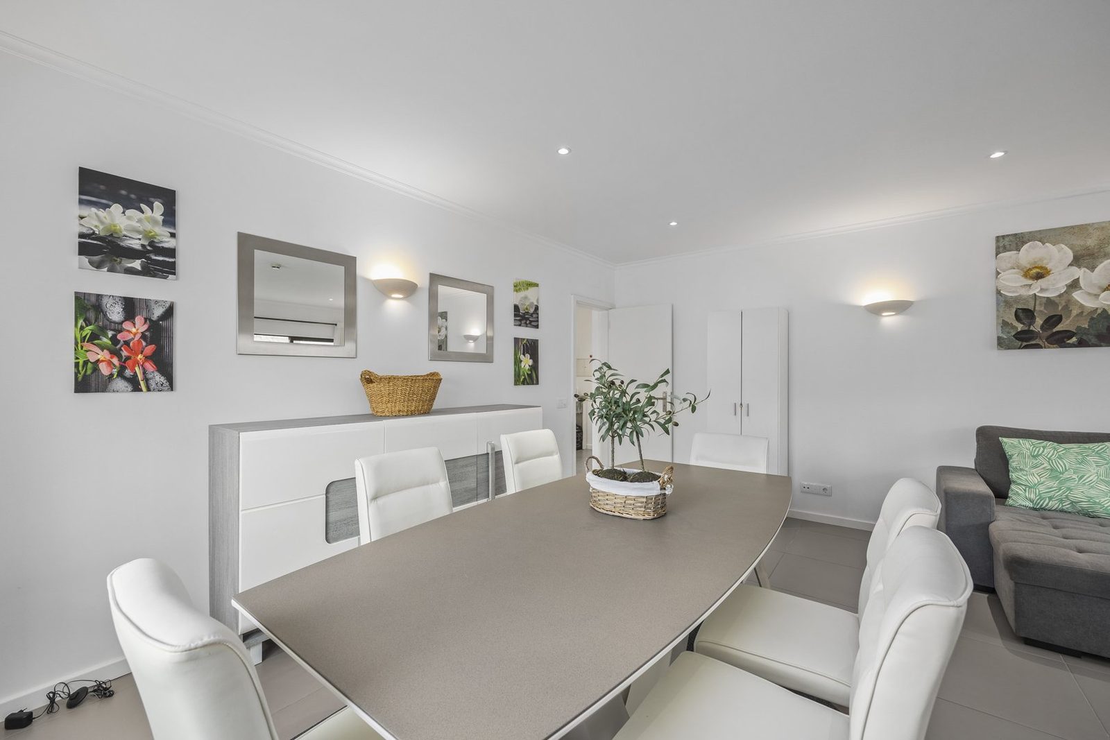 Dining table for six with sideboard and wall art