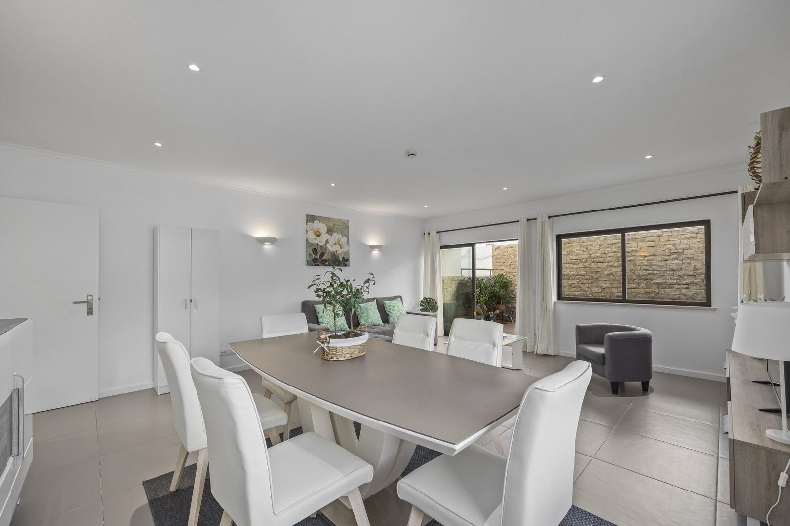 Open-plan living and dining room with terrace access