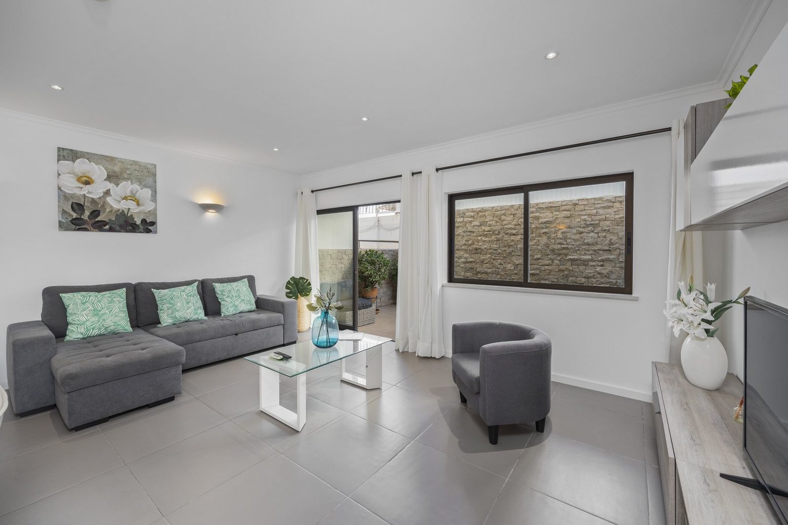 Living room seating area with terrace access