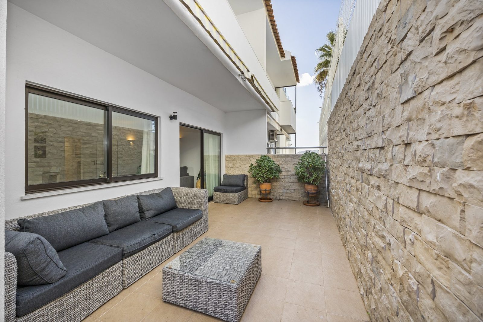 Terrace lounge seating with potted plants